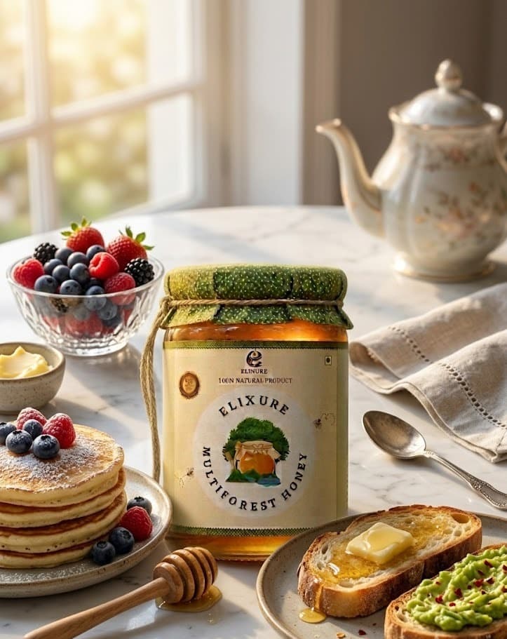 A jar of ELIXURE honey on a breakfast table with pancakes and toast